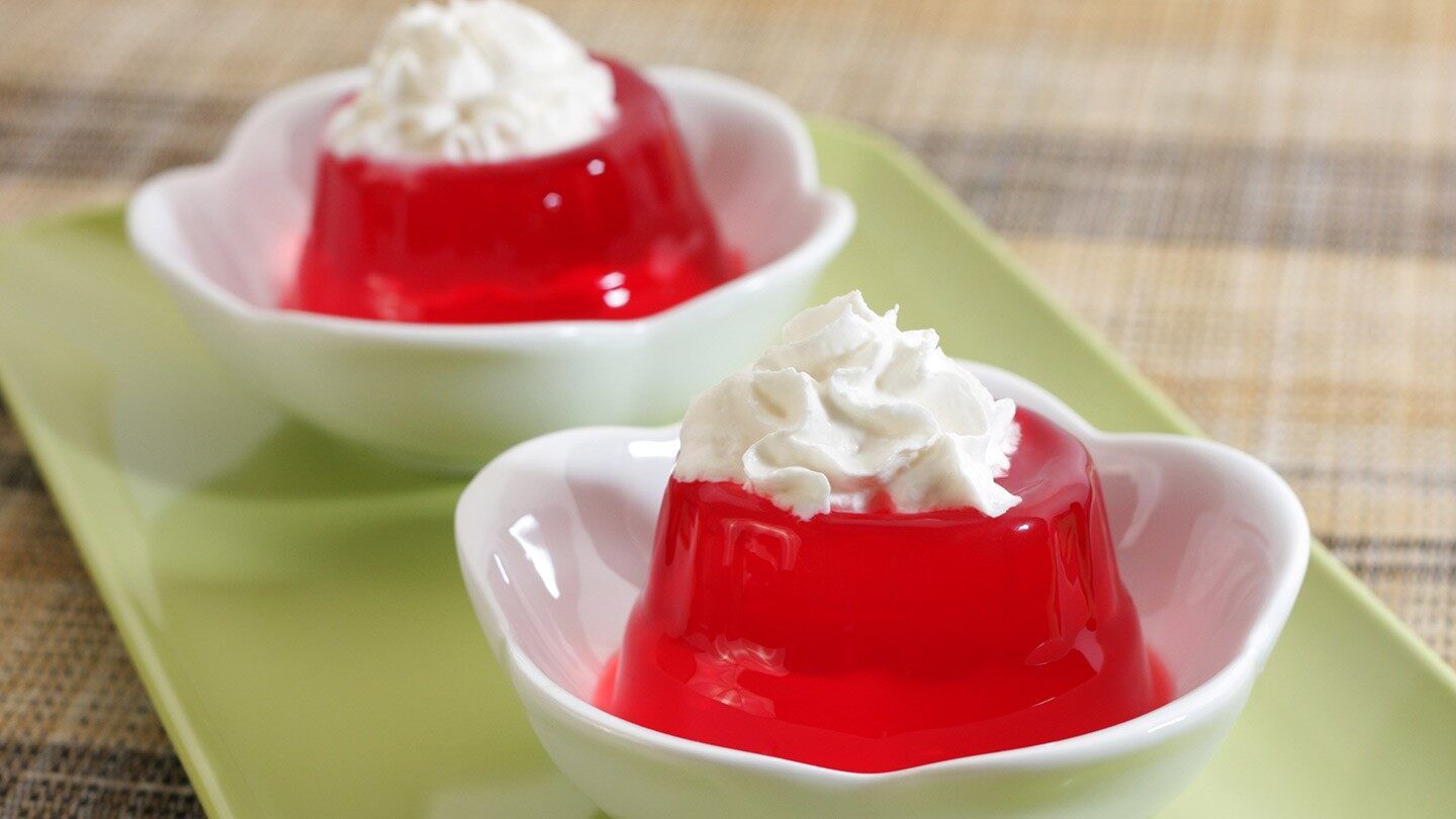 a bowl of gelatin with whipped cream