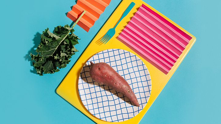 colorful abstract table setting with sweet potato and kale